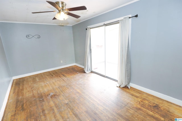 empty room with ceiling fan, wood-type flooring, and ornamental molding