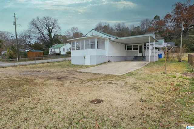 rear view of property with a patio area and a lawn