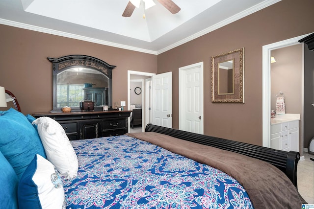 carpeted bedroom with ceiling fan, ornamental molding, and ensuite bath