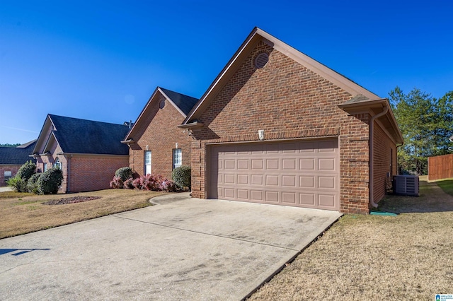 front of property featuring a garage and cooling unit