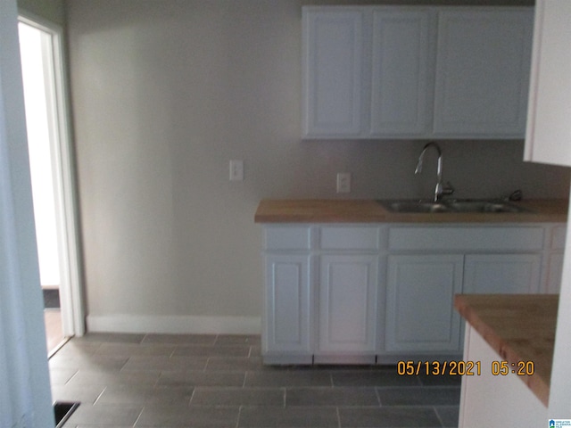 kitchen with sink and white cabinets