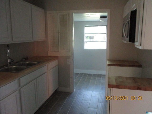 kitchen with white cabinets and sink