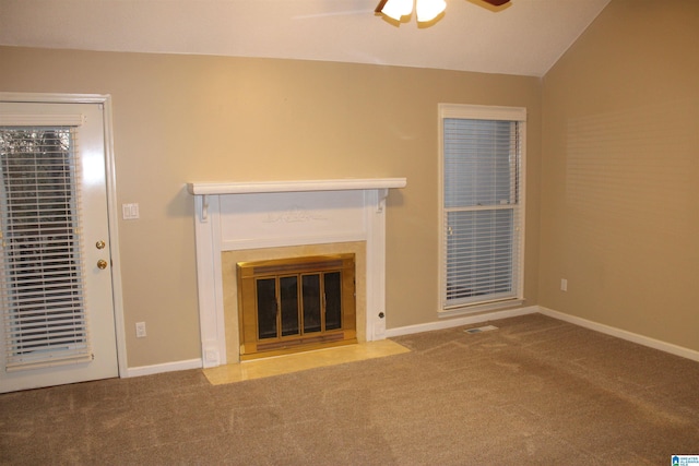 unfurnished living room with carpet, ceiling fan, and lofted ceiling