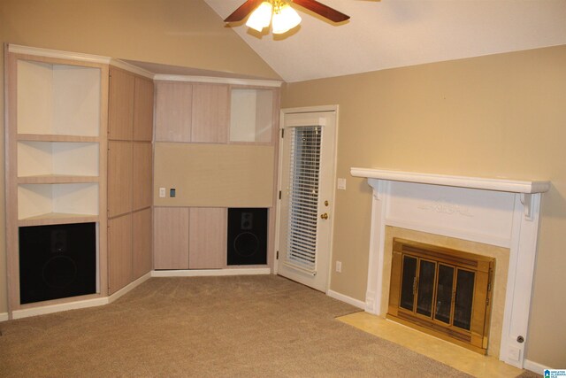 unfurnished living room featuring ceiling fan, lofted ceiling, and light carpet