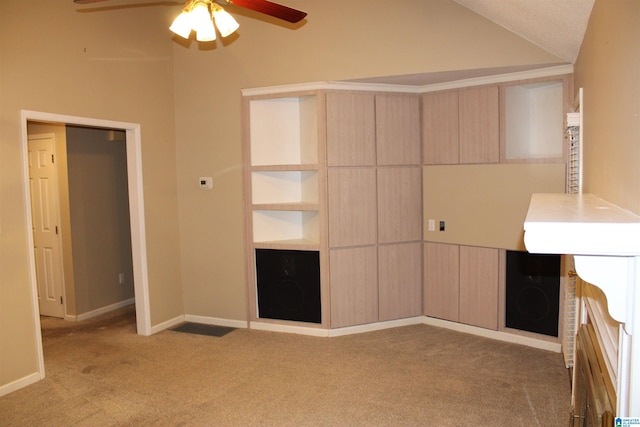 unfurnished bedroom with lofted ceiling, ceiling fan, and carpet floors