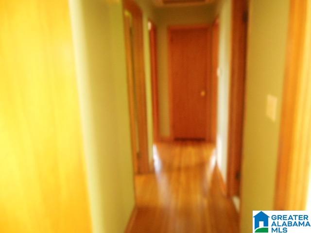 corridor featuring elevator and hardwood / wood-style floors