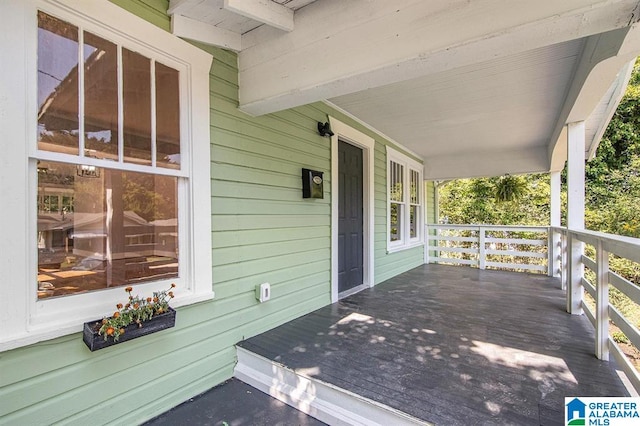 wooden terrace featuring a porch