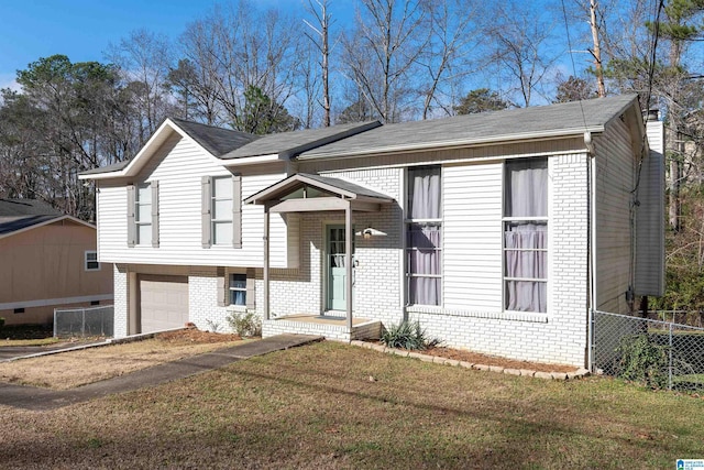 view of front of house with a garage and a front lawn