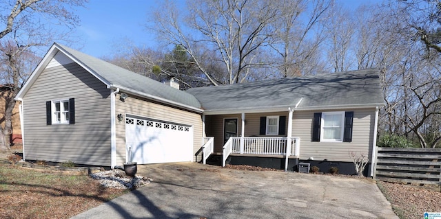 view of front of property with a porch and a garage