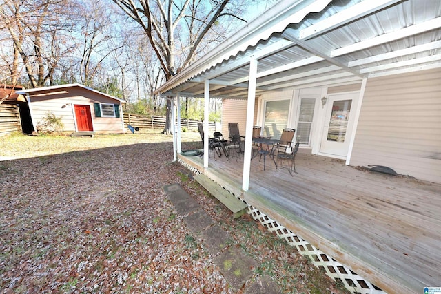 view of yard with a storage unit and a wooden deck