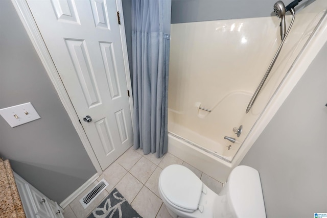 bathroom featuring tile patterned flooring, toilet, and shower / bathtub combination with curtain