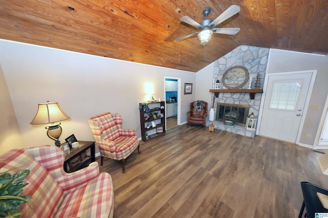 living room featuring hardwood / wood-style floors, wood ceiling, a fireplace, and vaulted ceiling