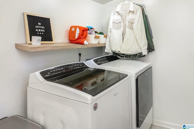 clothes washing area with washing machine and clothes dryer