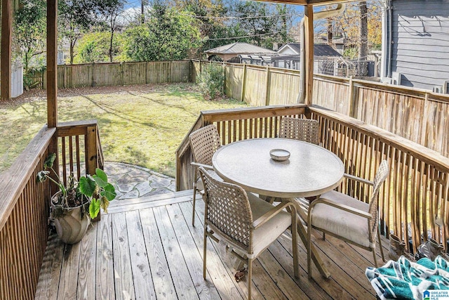 wooden deck with a lawn