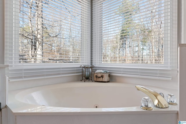 bathroom with a tub to relax in