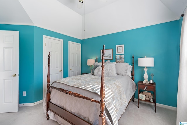 bedroom with carpet flooring, crown molding, and vaulted ceiling