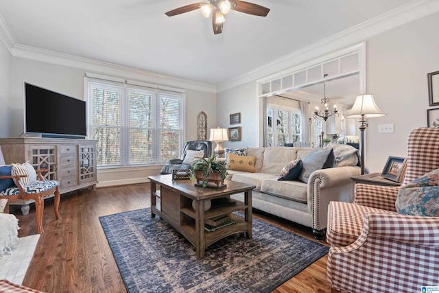 living room featuring crown molding, dark hardwood / wood-style flooring, and ceiling fan with notable chandelier