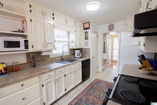 kitchen featuring sink, black dishwasher, washer / clothes dryer, electric stove, and light tile patterned flooring