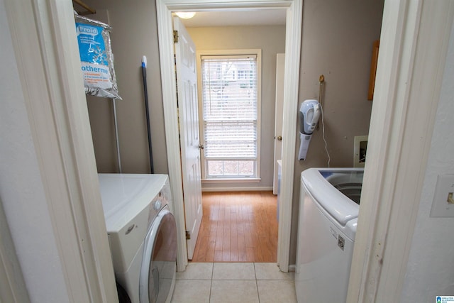 washroom featuring washer and dryer and light wood-type flooring