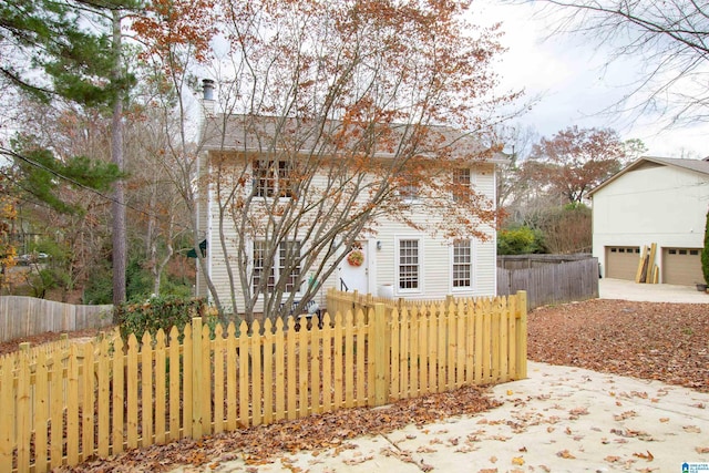 exterior space featuring an outbuilding and a garage