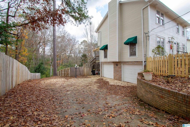 view of side of property with a garage