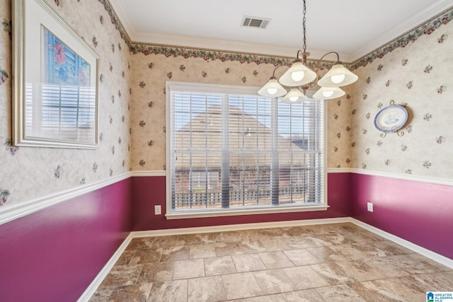 unfurnished dining area with a chandelier and ornamental molding