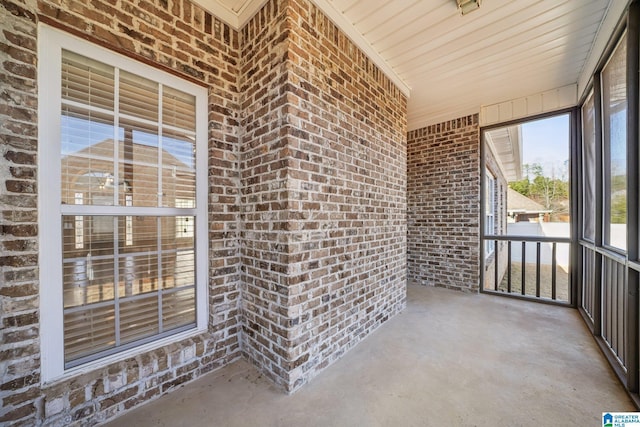 unfurnished sunroom with wooden ceiling