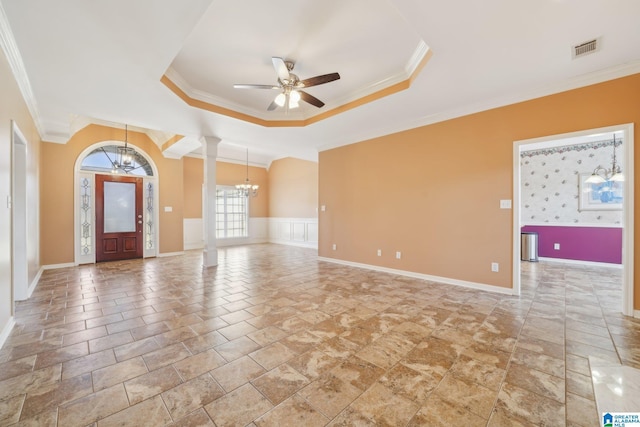 interior space featuring ceiling fan with notable chandelier, ornate columns, and crown molding