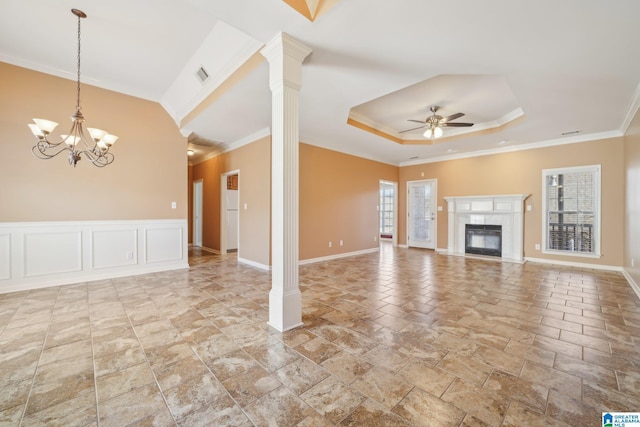 unfurnished living room featuring decorative columns, crown molding, and a healthy amount of sunlight