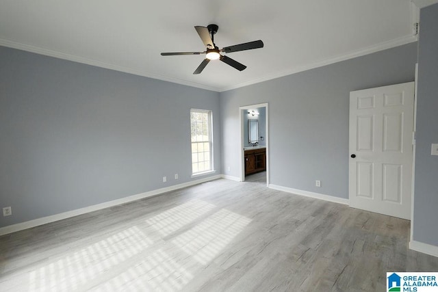 unfurnished bedroom with ornamental molding, light wood-type flooring, connected bathroom, and ceiling fan