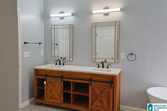 bathroom with vanity and a bathtub