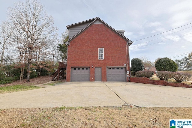 view of side of property featuring a garage