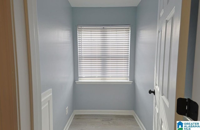 spare room with wood-type flooring