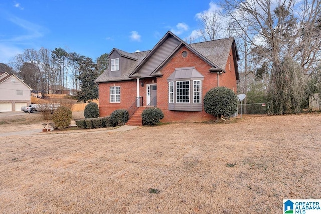 view of property featuring a front lawn