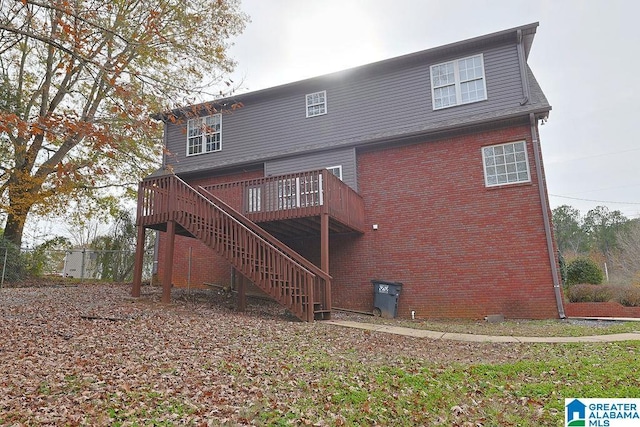 back of property with a wooden deck