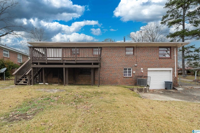 rear view of property with a garage, a wooden deck, stairway, a yard, and brick siding