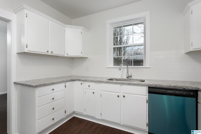 kitchen featuring white cabinetry, dishwasher, sink, dark wood-type flooring, and light stone counters