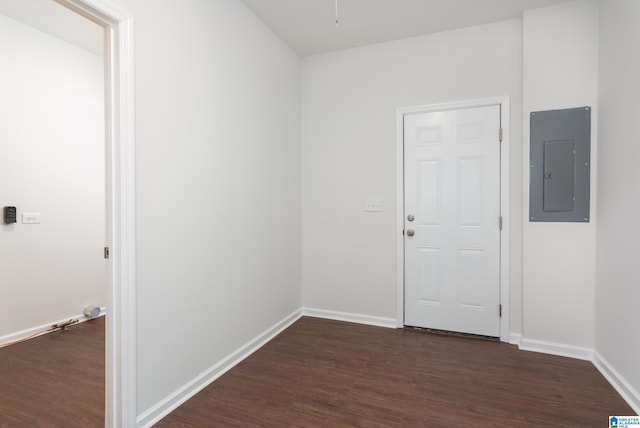 interior space featuring electric panel and dark hardwood / wood-style floors