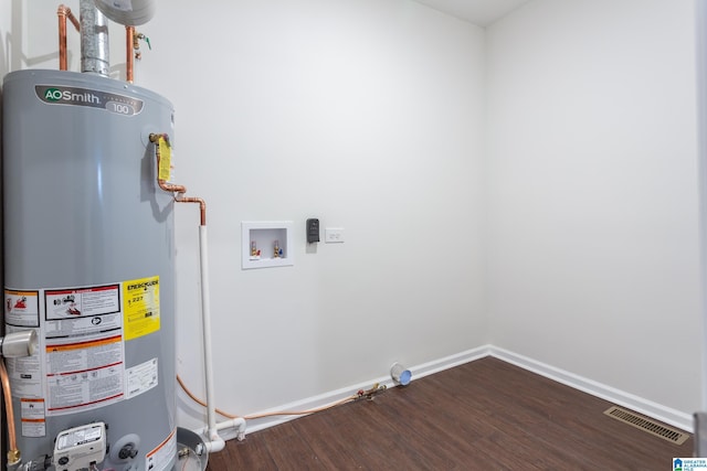 utility room with gas water heater