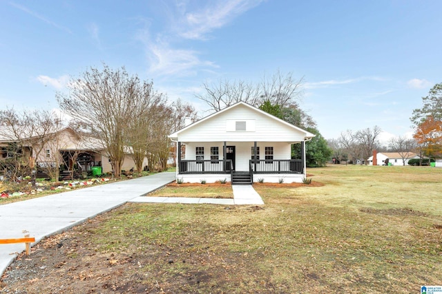 bungalow-style house with a front yard and a porch