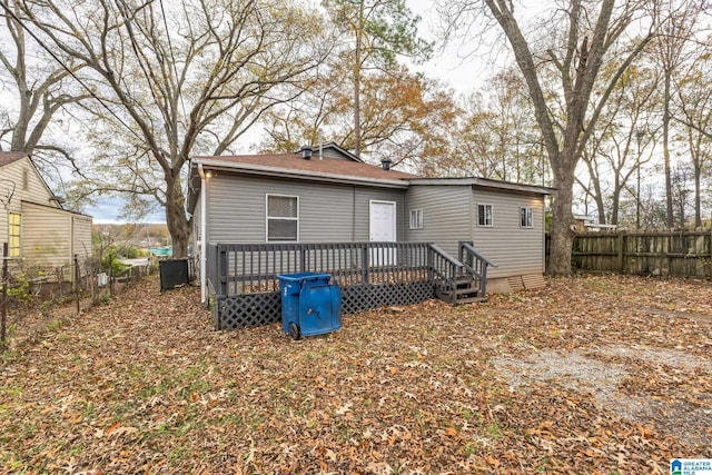 rear view of property with a deck