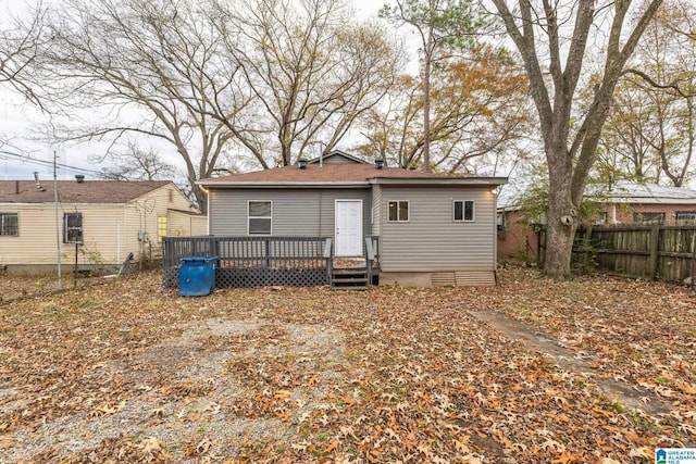 rear view of property featuring a deck