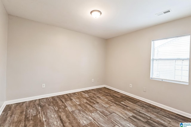 empty room with wood-type flooring