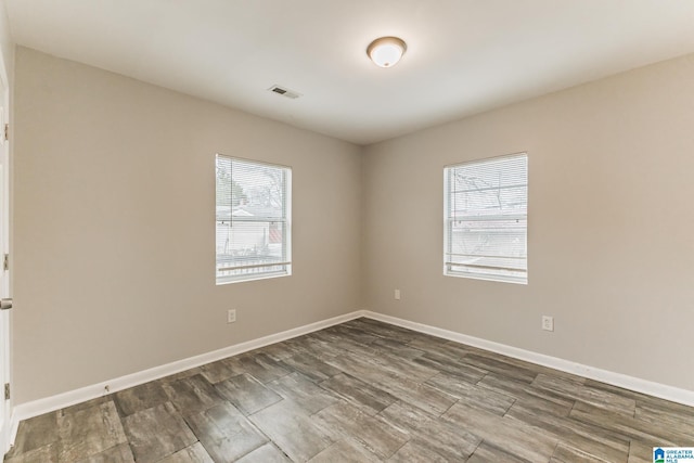 empty room featuring wood-type flooring