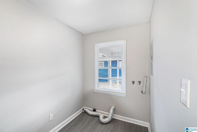 clothes washing area featuring hardwood / wood-style flooring, hookup for an electric dryer, and hookup for a washing machine