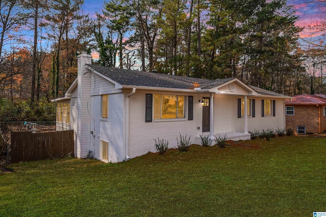 view of front of property with a yard