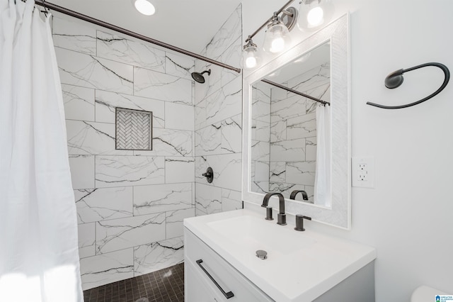 bathroom featuring vanity and a shower with shower curtain