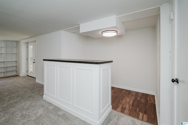 interior space with carpet floors and white cabinets