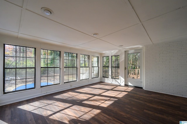 unfurnished sunroom featuring a wealth of natural light