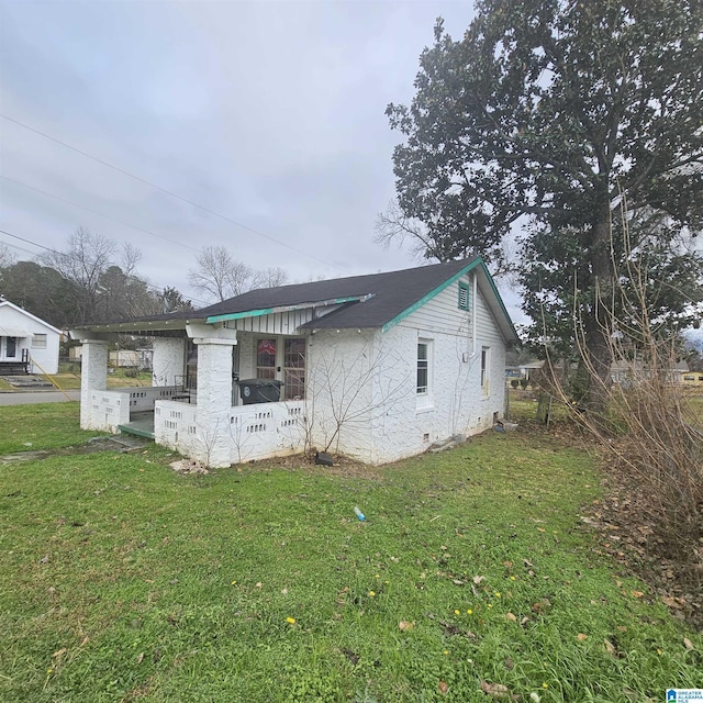 view of property exterior with a lawn